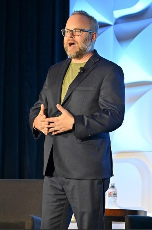 Nathan Phinney speaking on stage